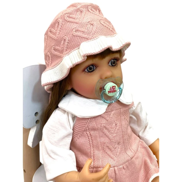 Kukla Reborn M4924 toxunma paltarlı, 55 sm