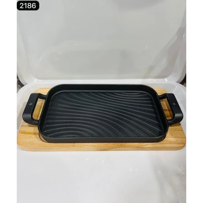 Сковородка 312, с деревянной подставкой, 17x29 см, чугунная Сковородка 312, с деревянной подставкой, 17x29 см, чугунная