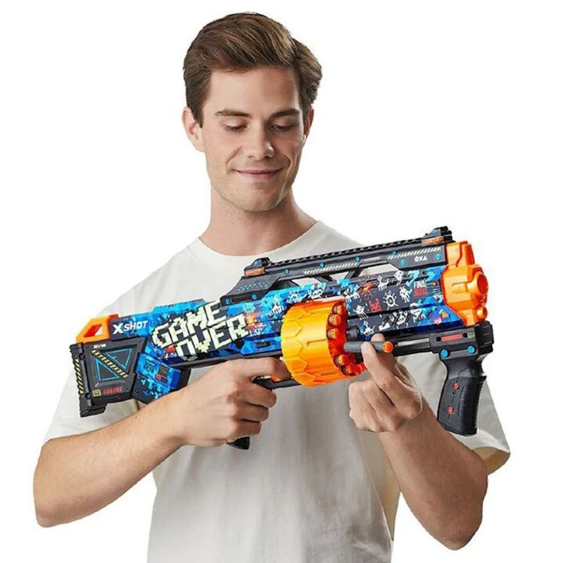 Бластер Zuru X-Shot Skins Last Stand Game Over, 16 дротиков, 8+, разноцветный Бластер Zuru X-Shot Skins Last Stand Game Over, 16 дротиков, 8+, разноцветный